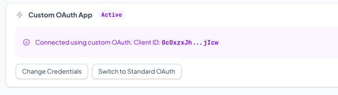 Custom OAuth configured state showing masked Client ID with Change Credentials and Switch buttons